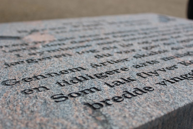 Memorial stone by water